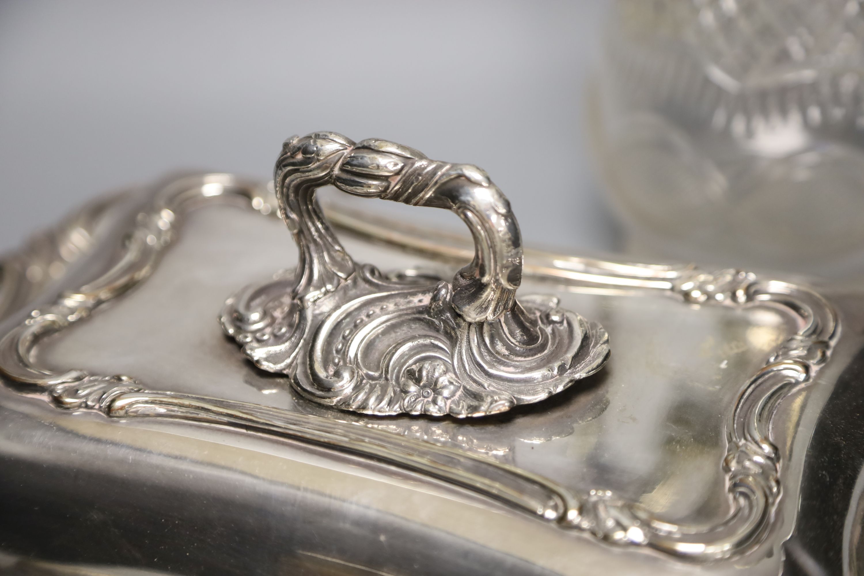 A Victorian plated tureen and cover and a claret jug